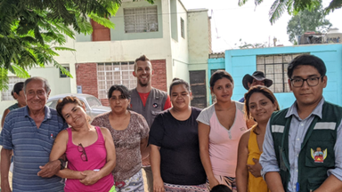 Water, Sanitation, and Hygiene Volunteer in Peru, with community members and counterpart