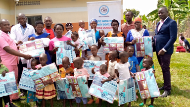 Mothers and Children receive mosquito nets