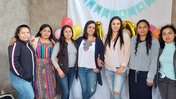 The Mujeres Mejorando Vidas staff in Guatemala gather to celebrate