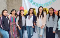 The Mujeres Mejorando Vidas staff in Guatemala gather to celebrate