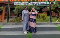 Nafi and Ibu Gigih in front of school
