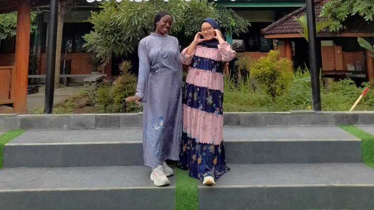 Nafi and Ibu Gigih in front of school