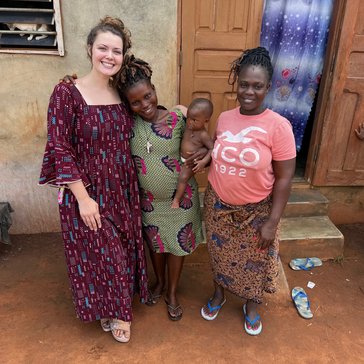katie with her host family in benin