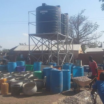 Clean water is piped from a nearby community and storied in two 10,000-liter tanks for consumption.
