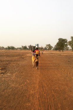 Women and children haul water from the river to Keisha’s community, 30 minutes away.
