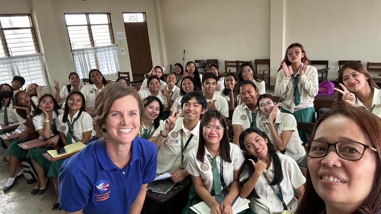 Julie engages college students during a "Volunteerism for the global citizen" course.