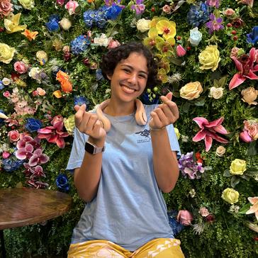 Following in her grandfather's footsteps, Ollie served as a Peace Corps Volunteer in Thailand.