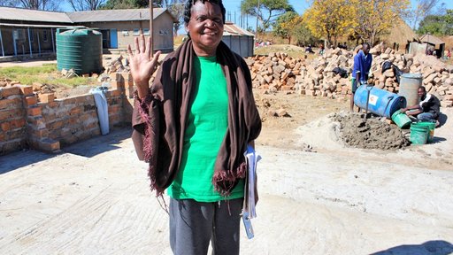 One of the nurses who decided not to retire when the new ward was built, standing on the foundation