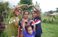 Volunteer William's host mother and two daughters, in Timor-Leste.