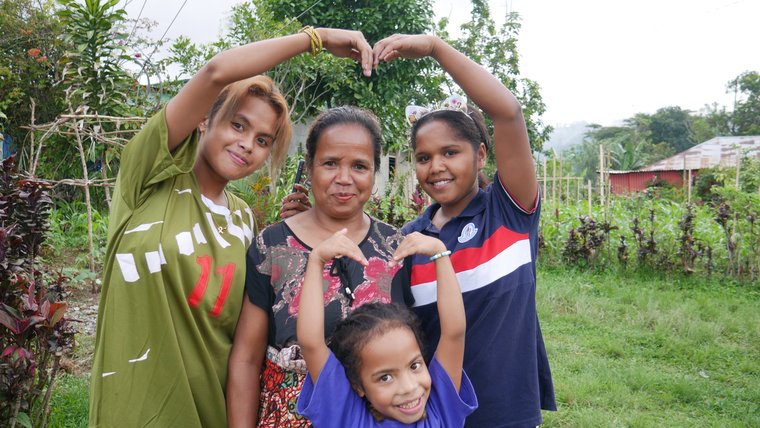 Volunteer William's host mother and two daughters, in Timor-Leste.