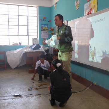 Teaching primary school students about trash management.