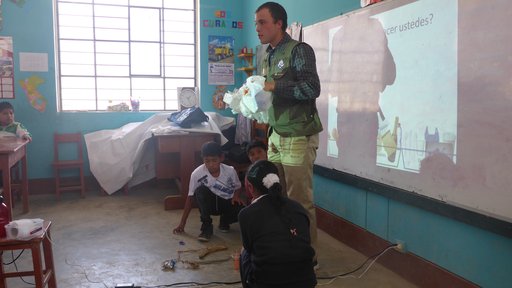 Teaching primary school students about trash management.