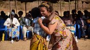 Peace Corps Malawi Volunteer running to hug her host mother