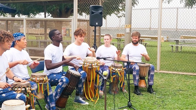 PCVs perform during swearing in ceremony in Senegal.