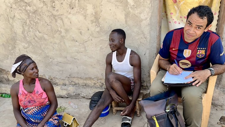 Sevi makes a home visit as part of his work as a Health Volunteer in Togo.