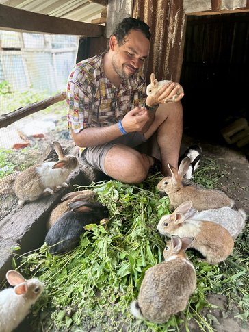 Sevi enjoys spending time with rabbits and other animals he cares for in Togo.