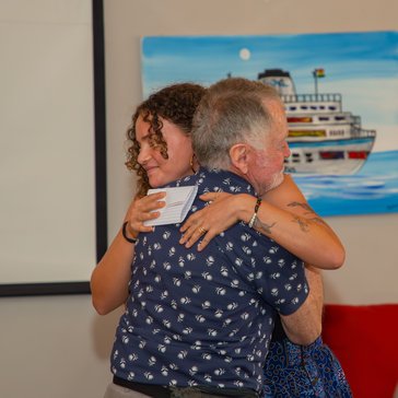 Asha embraces her grandfather Steve during his visit to Ghana.