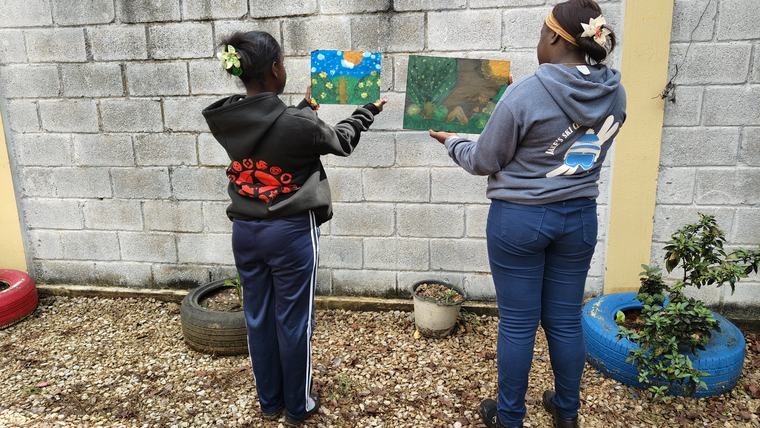 students in front of wall