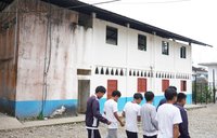 students in front of school
