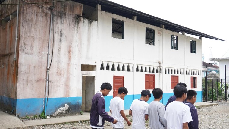 students in front of school