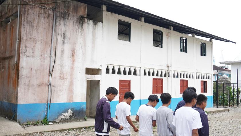 students in front of school