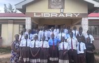 students in front of library