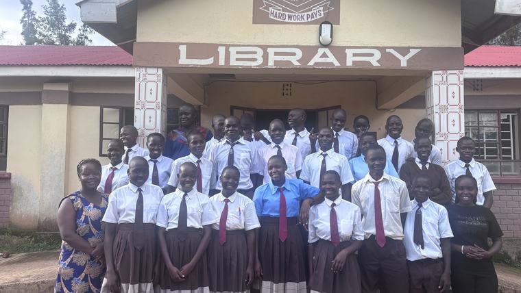 students in front of library