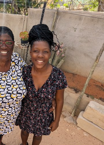 Kj has stayed in touch with her Namibian host mother (here, with her granddaughter) over the years since her service.