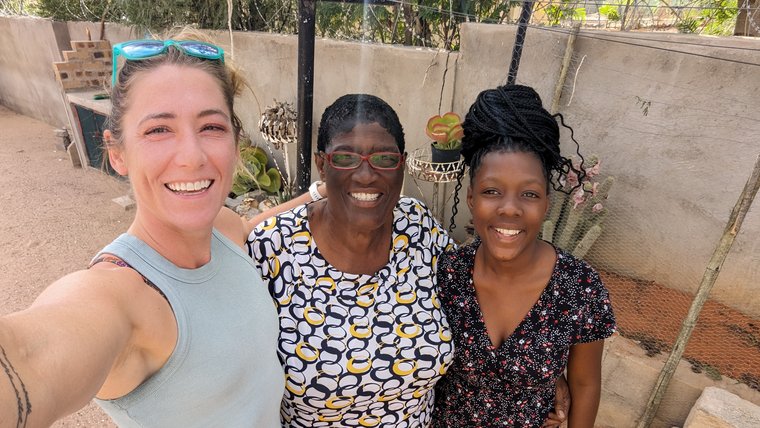Kj has stayed in touch with her Namibian host mother (here, with her granddaughter) over the years since her service.