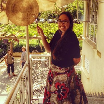 Elyse “gonging out,” a tradition to mark the end of service and celebrate becoming an official returned Peace Corps Volunteer