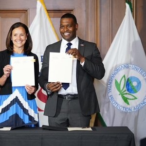 Peace Corps Director Carol Spahn and EPA Administrator Regan holding up a signed MOU