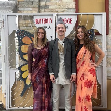 Volunteers Victoria, Tommy and Kennedy attend a Nepali wedding.