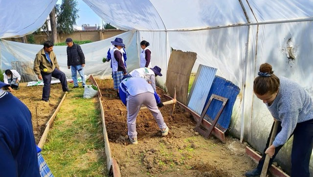 Emily helps out in a student-run greenhouse in Peru.
