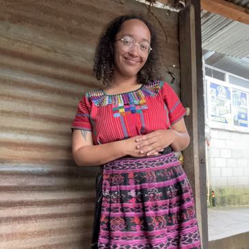 Peyton wears traditional Guatemalan clothing.