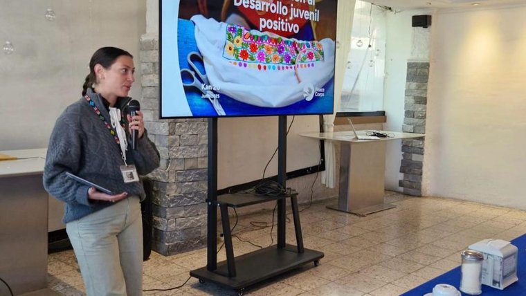 Madison introduces a positive youth development workshop for regional administrators in Guatemala.