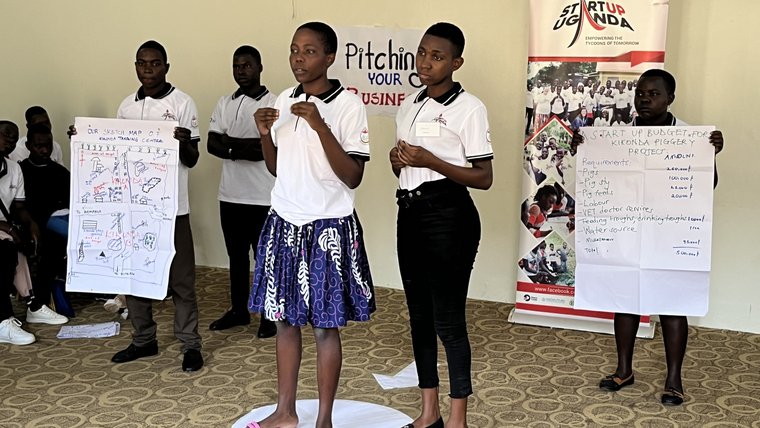 Youth in Uganda pitch their business ideas to a panel of judges