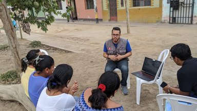 Bryan Ramirez, Water, Sanitation, and Hygiene Volunteer in Peru, facilitating a workshop.