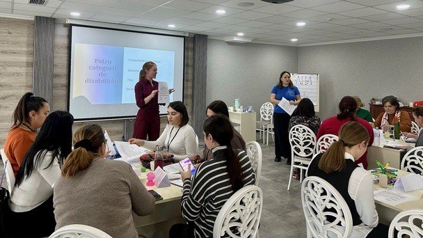 Amy and her counterpart Ana host a workshop for teachers of children with disabilities in Moldova.