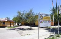 Photo of buildings with a Sam Nujoma Multi Purpose Centre sign in front