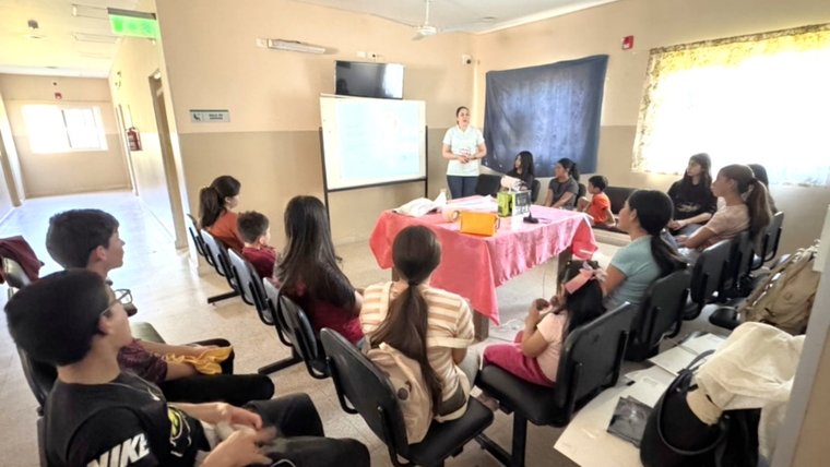 Scarlett teaches students health topics at a local health post in Paraguay.