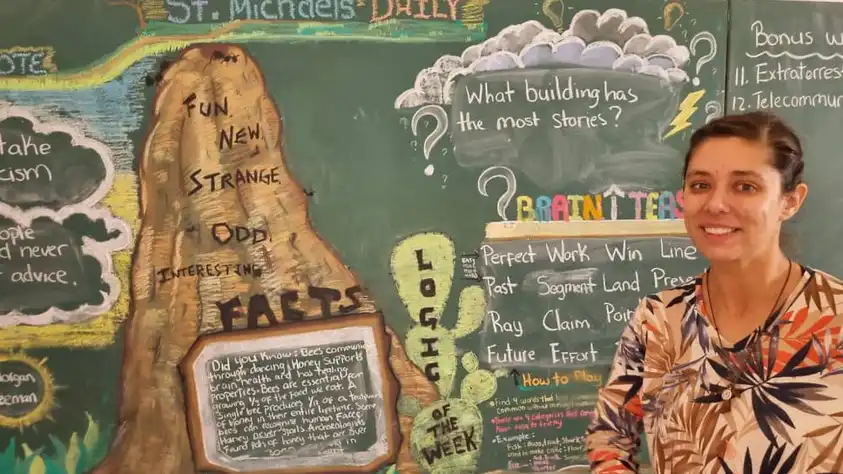 Salina D. at chalkboard
