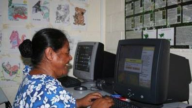 Woman working on a computer.