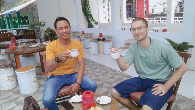 Sean shares a cup of coffee with his counterpart teacher in Indonesia.