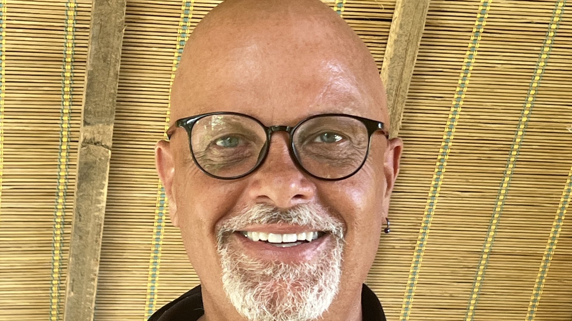 Man smiling at the camera.