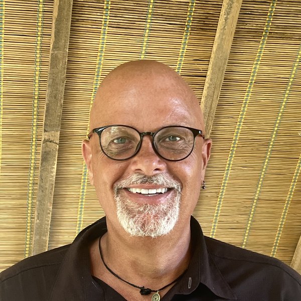 Man smiling at the camera.