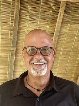 Man smiling at the camera.