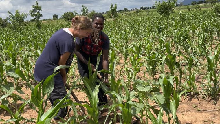 Sophie learns to farm with her host mom in the family fields.