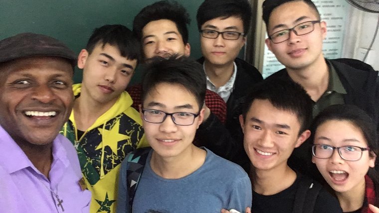 Andre Boyer with students in China