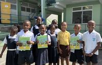 Students proudly display their newly published book
