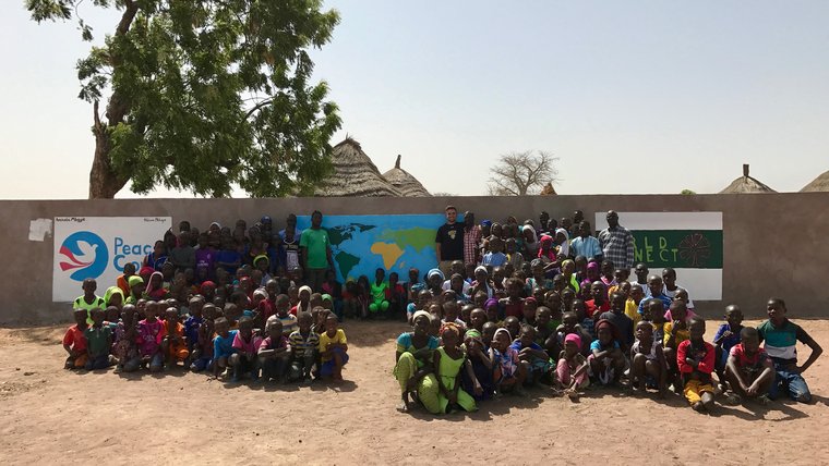 Students, teachers and PCV Michael.jpg